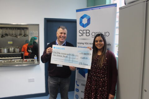 SFB's Asha presenting cheque donation to David from The Bridge Hoimelessness To Hope, a Leicester based charity